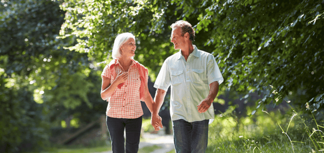 couple walking through woods